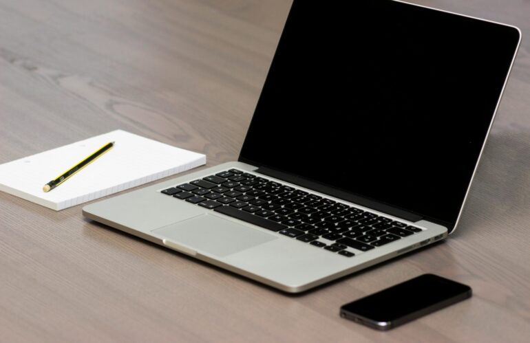 Free Silver Macbook Beside Iphone Stock Photo